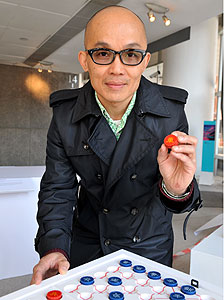 Magic touch: Polytechnic University Professor Michael Siu shows his Chinese chess game for the visually-impaired. Magic touch: Polytechnic University Professor Michael Siu shows his Chinese chess game for the visually-impaired.