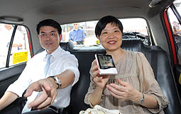Edward Yau in taxi with Audrey Eu