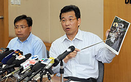 Ivan Lee and KK Lau explain arrangements for flood victims