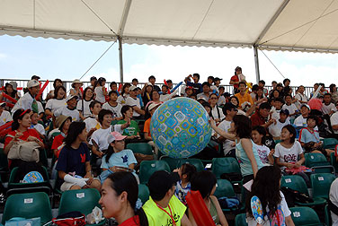 The crowd's tossing a giant beach ball