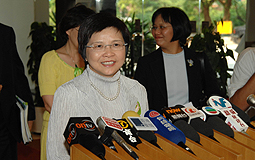 Rita Lau speaks to the media