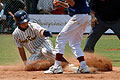 Hong Kong player sliding to the plate