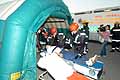 helping 'injured' inside makeshift tent